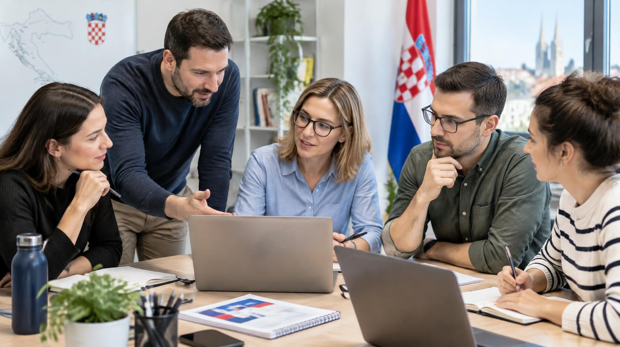 Team of developers collaborating around a table