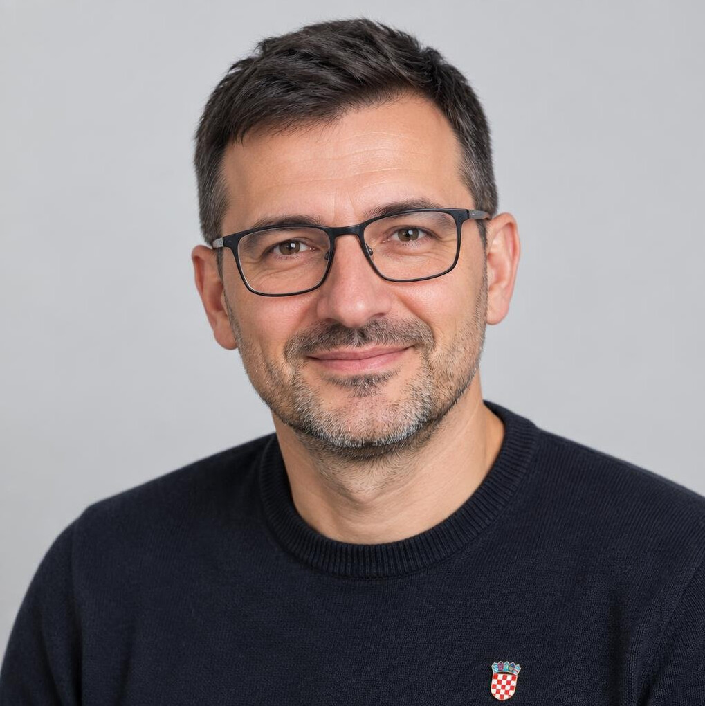 Studio portrait of a man with glasses